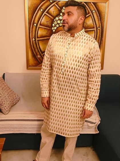 A festive Diwali look featuring a gold and cream patterned kurta. This ensemble is a perfect example of classic ethnic wear for celebrations.