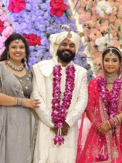 A picture with the happy couple and their family. I was honored to be a part of their special day.
