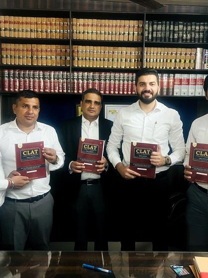 With fellow advocates and my CLAT book. My aim is to get this guide into the hands of as many aspiring lawyers as possible, providing a solid foundation for their law school entrance preparation.