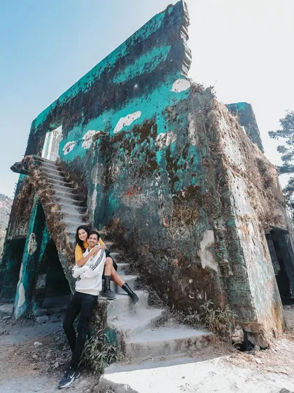 A wide angle shot showing the couple at a unique, weathered location in the hills. Using interesting architecture, even ruins, can create a powerful and artistic image.