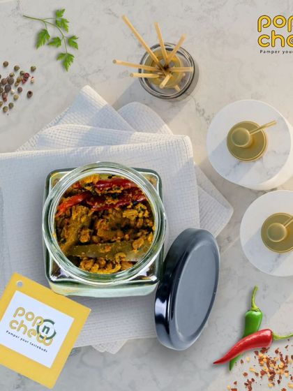 This is our pride and joy, the authentic mango pickle. Made with a secret family recipe, the sun-ripened mangoes are blended with our special spices to create a burst of flavour and nostalgia in every jar.