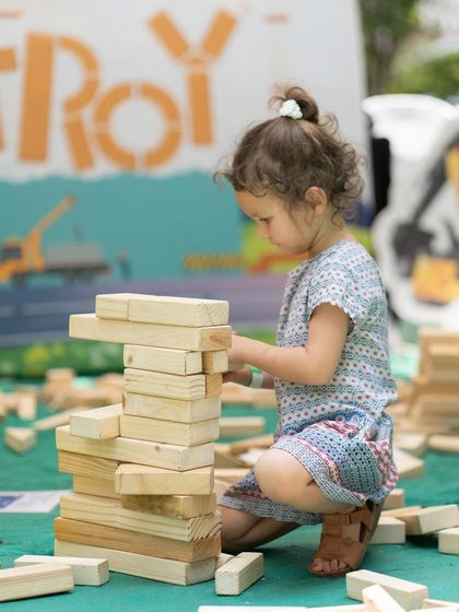 The giant building block zone is always a favorite. This little girl is concentrating hard on her tower, learning about balance and structure while having a blast. It’s amazing to see what they come up with!