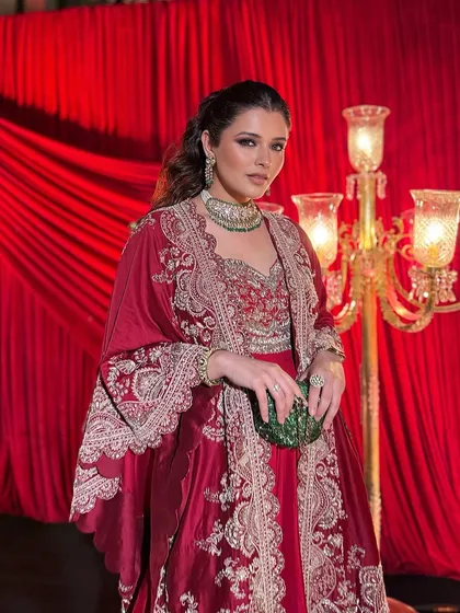 The regal setting enhances the drama of this Sufi night look. The makeup is designed to be captivating under ambient lighting, with a focus on defined eyes and glowing skin.