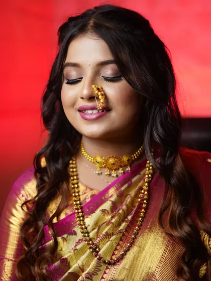 A happy, glowing bride. The soft waves in her hair and the radiant makeup create a look of effortless beauty.