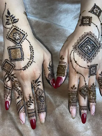 A contemporary geometric design with squares connected by leafy vines and dotted chains, perfect for someone wanting a unique, non-floral pattern.