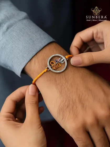 A rakhi is more than a thread, it is a bond that shines. This lifestyle shot captures the emotion of Raksha Bandhan, featuring a custom silver rakhi designed to be as special as the relationship it celebrates.