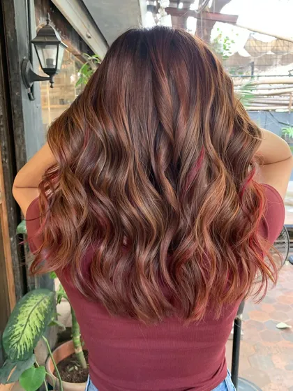 The back of the chestnut and red hair. The colors are warm and beautiful, perfect for any season.