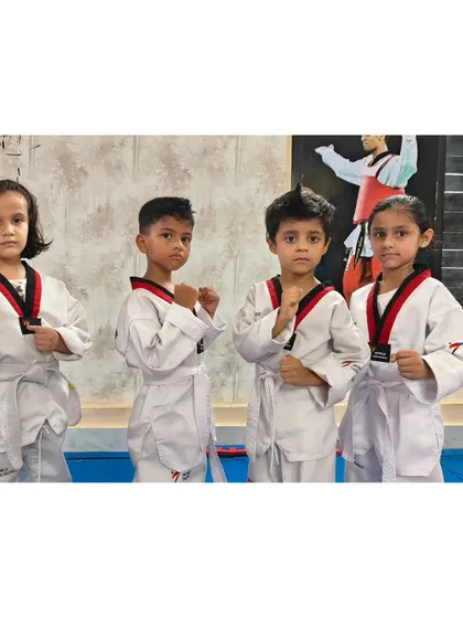 A group of our youngest students ready for class. They are learning the importance of focus and discipline in a fun environment.