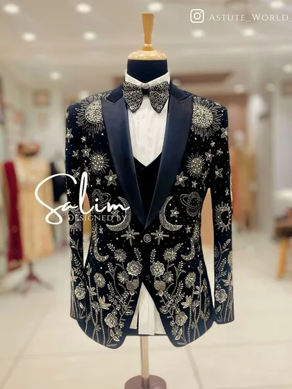 This is one of my most detailed creations, a celestial-themed tuxedo jacket. It features hand-embroidered planets, stars, and moons on rich black velvet, designed for a truly astronomical impact at any black-tie event.