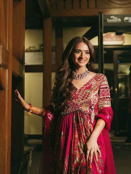 A happy, smiling shot of Vasav. Her natural-looking makeup enhances her joy, making her look radiant and approachable.