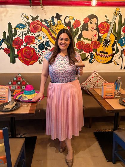 Sundays are for margaritas and tacos. Here I am at Miss Margarita by Arriba, soaking in the vibrant atmosphere. I always include myself in the setting to create relatable lifestyle content that shows a real person enjoying the experience.