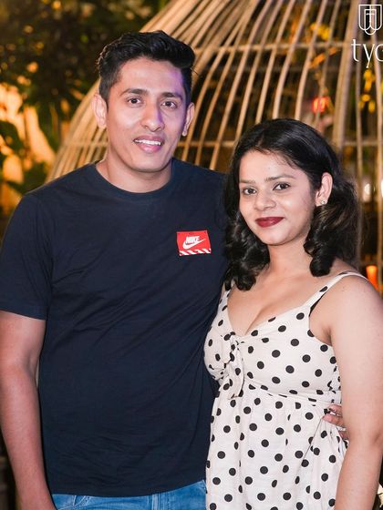 A couple posing in the outdoor area of TYD.