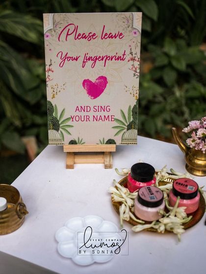A creative fingerprint station at a wedding, inviting guests to leave their mark and sign their name.
