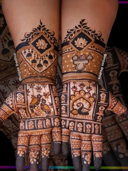 A striking design featuring peacocks and jhumka (traditional earring) motifs. The dark, filled-in areas create a bold contrast that looks amazing.