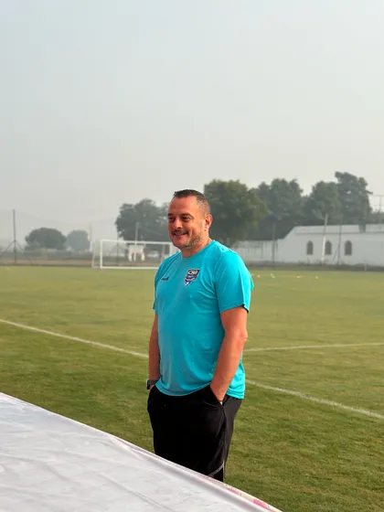 A coach from The Football Academy in Dubai addressing players during a trial at our ground. We facilitate international scouting opportunities.
