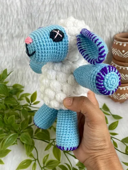 This cute blue sheep is from the popular kids' show Cocomelon. The bobble stitch gives it a fluffy texture, and the bright colors make it a perfect toy for little ones.