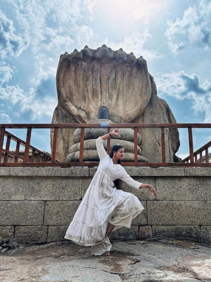 Another pose from my dance exploration at Lepakshi. The natural backdrop of the sky and the ancient stone creates a stunning stage for artistic expression.