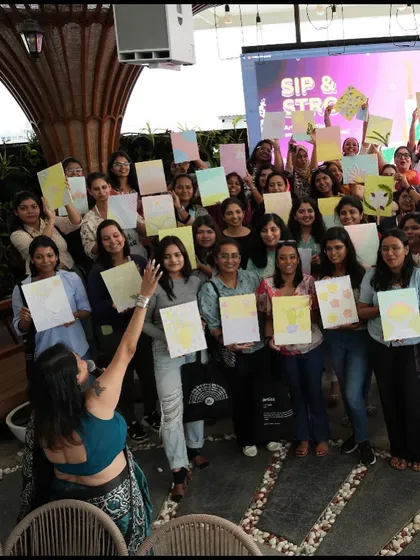The team from Meesho proudly holding up their finished texture paintings. It was an amazing experience to see so many people, most of whom had never painted before, create such beautiful and personal artworks.