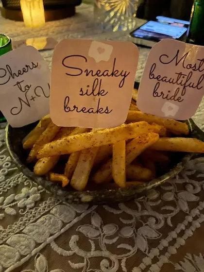 Even a simple bowl of fries can be part of the theme. Here, I've added multiple custom-designed flags with fun messages for the bride-to-be, making every dish special.