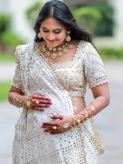 Celebrating my own baby shower in a custom House of D'oro hand harness. Jewelry is about marking life's most precious moments, and I loved creating this piece to highlight the joy of this special day.