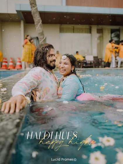 Making a splash! We love it when couples are unapologetically themselves. This fun-filled pool dive during a Haldi celebration shows that we are there for the laughter and chaos, not just the formal shots.