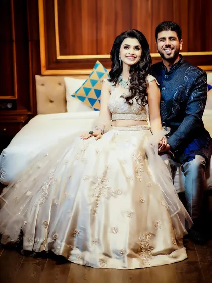 A happy and relaxed portrait of the couple on their reception day.