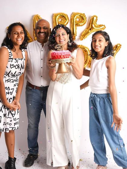 Celebrating mom's birthday with a fun cake smash for the whole family! These sessions are not just for babies. They are a joyful way to mark any special family occasion.