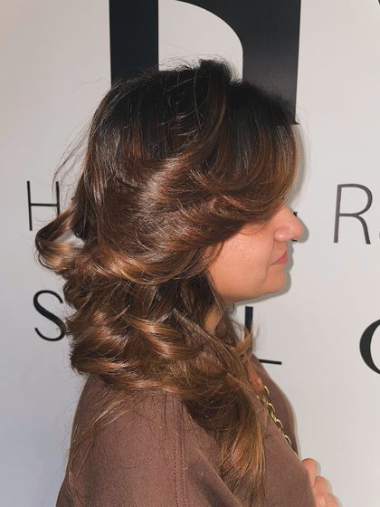 A side view of the copper-brown global color, showing the feathered layers and beautiful styling.