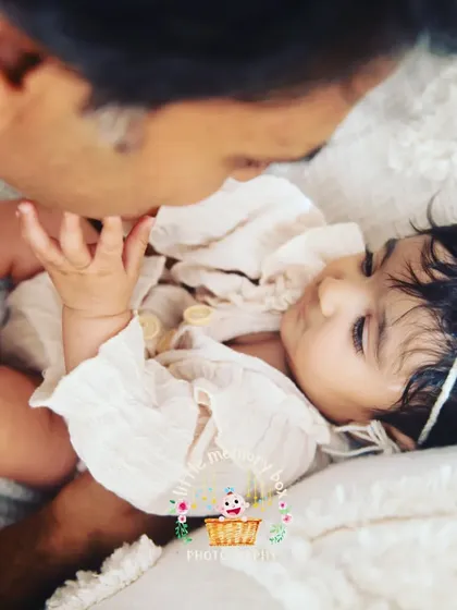 A tender moment between a father and his daughter. These quiet, gentle interactions are just as powerful as the big smiles. It's about capturing that feeling of safety and love.