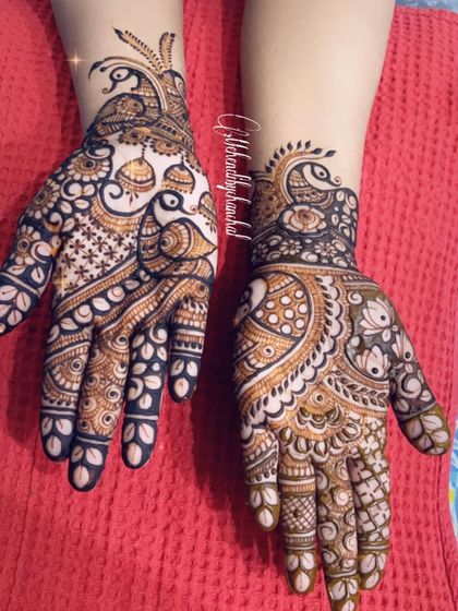 A beautiful design with peacocks and jhumkas, perfect for any festive occasion.