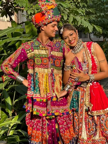 Another beautiful shot of this couple. The intricate details on both the men's Kedia and the women's chaniya choli are designed to complement each other perfectly.