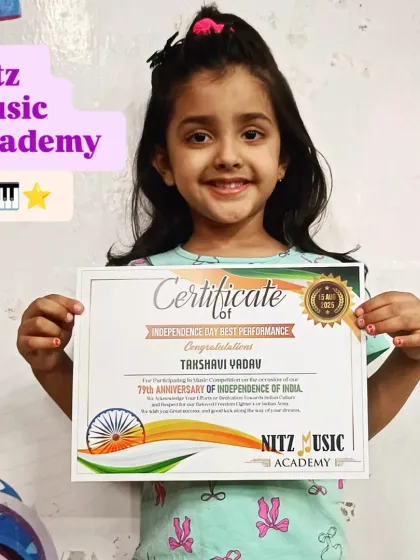 Takshavi, one of the youngest participants in our 2025 Independence Day competition, proudly holds her certificate. She won the 'Best Performance' award for her rendition of 'Nanha Munna Rahi Hoon'.