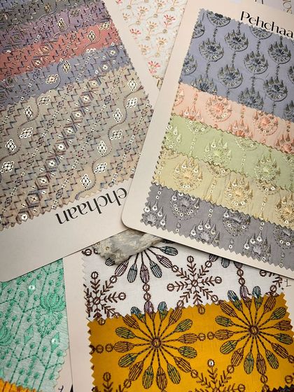 A vibrant collection of embroidered and patterned fabrics from our 'Pehchaan' collection, perfect for creating unique traditional wear.