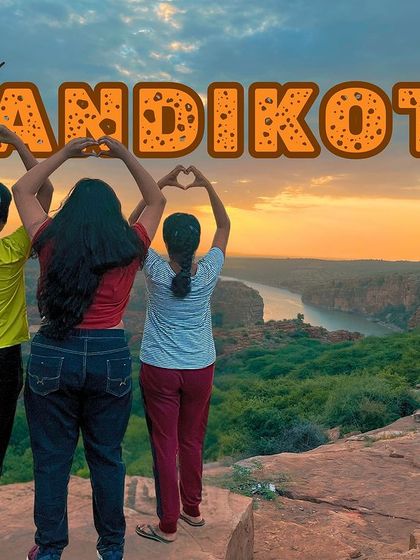 A fun and creative group pose at the edge of the Gandikota canyon during sunset.