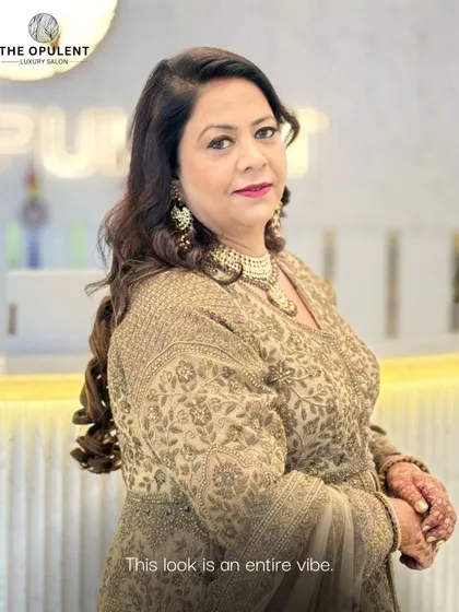 A side profile of our elegant occasion makeup, showing how the soft curls and statement jewelry come together. We ensure every angle is picture perfect for your event photos.
