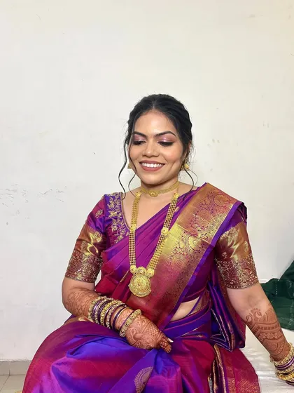 The smile of a happy bride-to-be! Her makeup is soft yet defined, ensuring she looks stunning both in person and in her engagement photos.