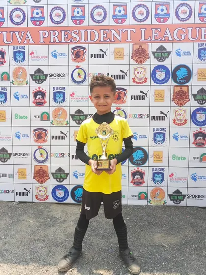 Our Man of the Match, Shaurya Parikh, proudly posing with his trophy. His hard work on the field paid off.