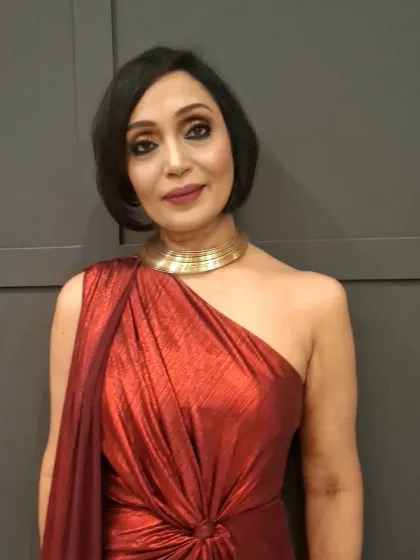 A close-up of the makeup for Dr. Jas, showing the soft glam eyes and perfectly defined lips that create a timeless and powerful look.