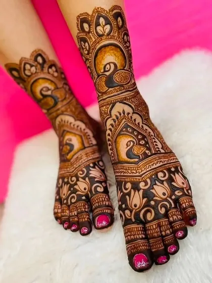 A close-up of the elegant peacock foot mehndi design, showing the beautiful symmetry and detail.