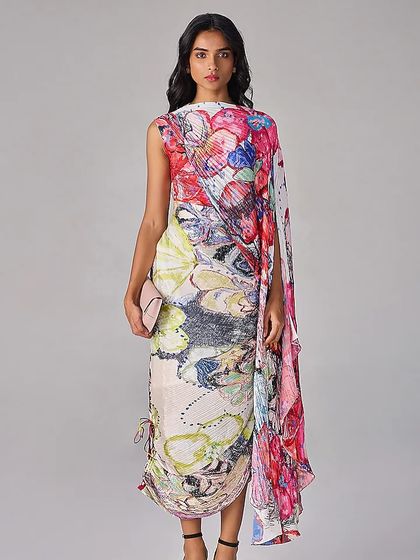 A full view of a one-shoulder draped dress with a vibrant, abstract floral print, perfect for making an artistic statement.