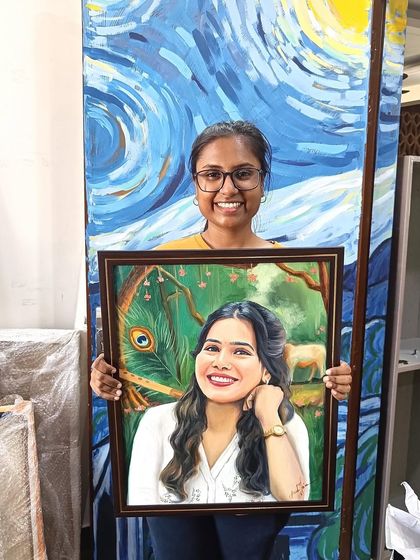 Me holding the finished Krishna-themed portrait in front of my studio's "Starry Night" wall.