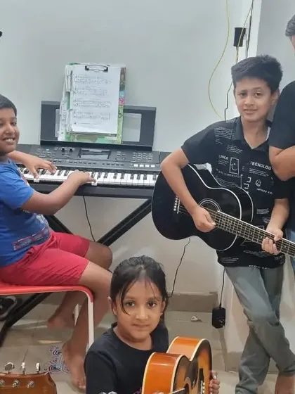 The band's all here! A group photo from one of our recent jam sessions with young students at my home.