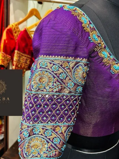 This is where my passion for detail comes to life. A custom bridal blouse in a rich purple, featuring intricate zardosi and threadwork with pops of turquoise, designed to be the statement piece of a bridal ensemble.