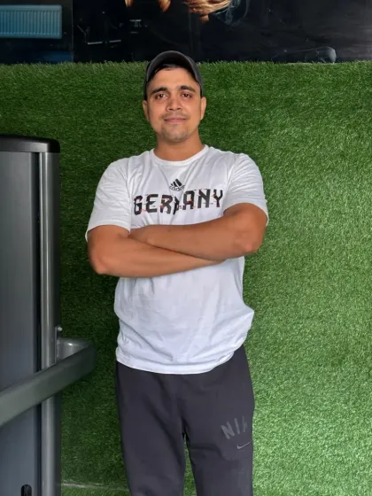Arms crossed, ready to coach. My focus is on discipline and technique.