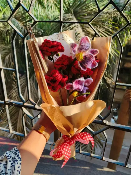 Another angle of the rose and orchid bouquet, catching the sunlight. The mix of textures and colors makes this arrangement so special.