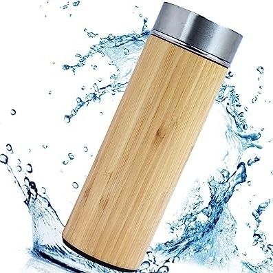 A dynamic shot of our bamboo water bottle with a splash of water, emphasizing its use for hydration. This insulated flask keeps water hot or cold for up to 24 hours, making it the perfect organic and stylish choice for all ages.