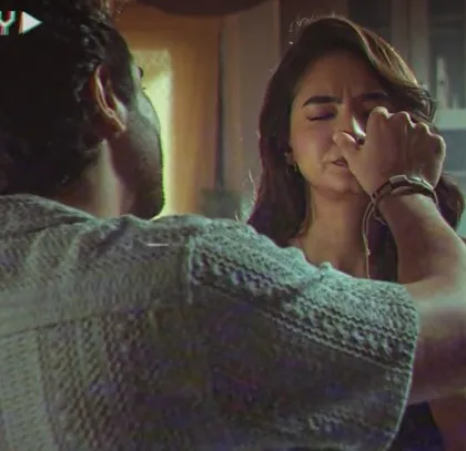 An emotional moment from the film. Even in simple scenes, the wardrobe is carefully chosen to enhance the mood and character. Here, the soft, comfortable clothing adds to the scene's intimacy.