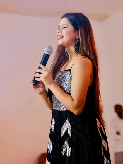 A profile shot on stage, focused and ready for the next segment. A good host is always present and engaged.