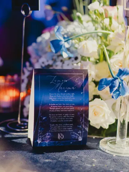 A close-up of the personalized table stationery, featuring a poetic message that ties into the celestial theme of the evening.