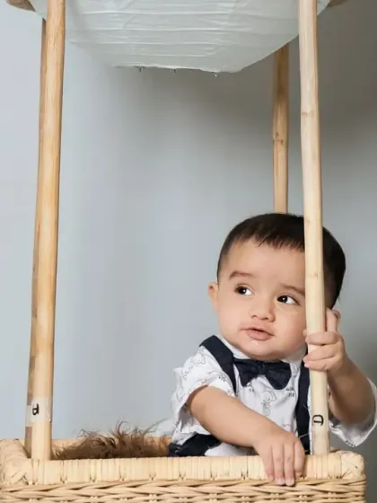 A dapper little boy looking thoughtful in our hot air balloon.